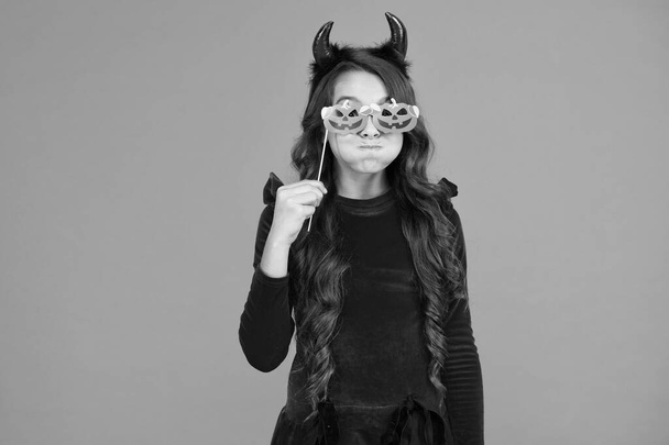 halloween child in suit and imp hors with pumpkin party glasses makes faces emotionally, halloween holiday - Foto, Imagem
