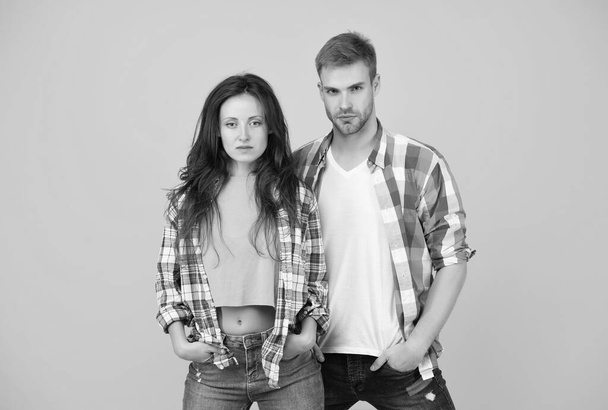 Their style is a lot more casual. Couple in casual wear. Vogue models yellow background. Fashion clothes. Contemporary streetwear. Trendy lifestyle. Dont miss our latest trends in clothing - Fotoğraf, Görsel