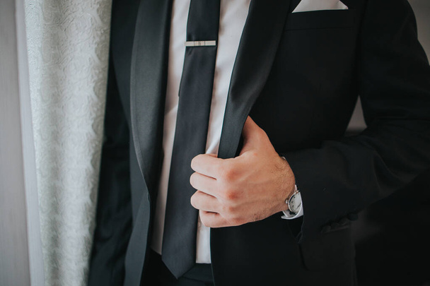The groom getting dressed for his wedding ceremony - Фото, изображение