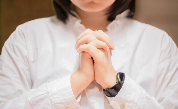 Close up of faithful praying, hands folded in worship to god. Concept for religion, faith, prayer and spirituality. - Foto, Imagem