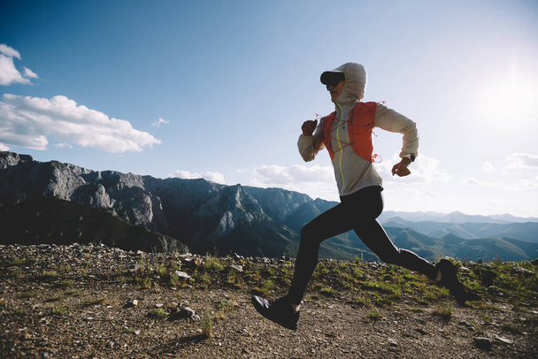 Fitness woman runner running at mountain top - Foto, Imagem