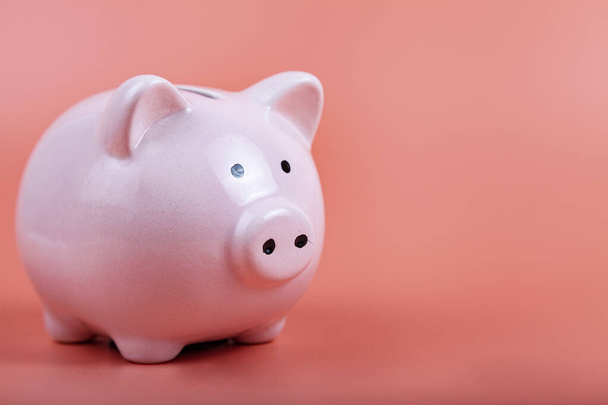 Pig piggy bank on a pink background. Money accumulation concept. - Foto, Imagem