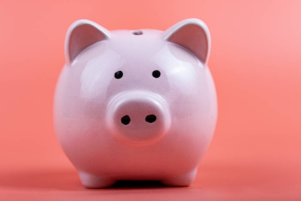Pig piggy bank on a pink background. Money accumulation concept. - Zdjęcie, obraz
