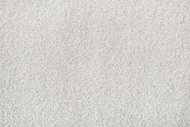 Witte krullende wol naadloze textuur achtergrond. textuur met kort fabrieksmateriaal. - Foto, afbeelding