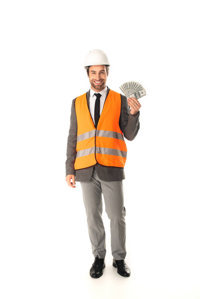 Architect in harde hoed met geld op witte achtergrond  - Foto, afbeelding