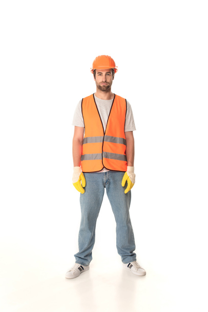 Builder in gloves and safety vest looking at camera on white background  - Foto, Imagem