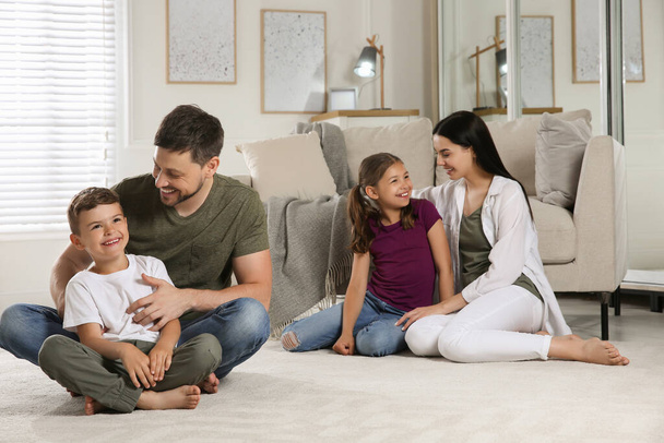 Happy family spending time together at home. Adoption concept - Фото, зображення
