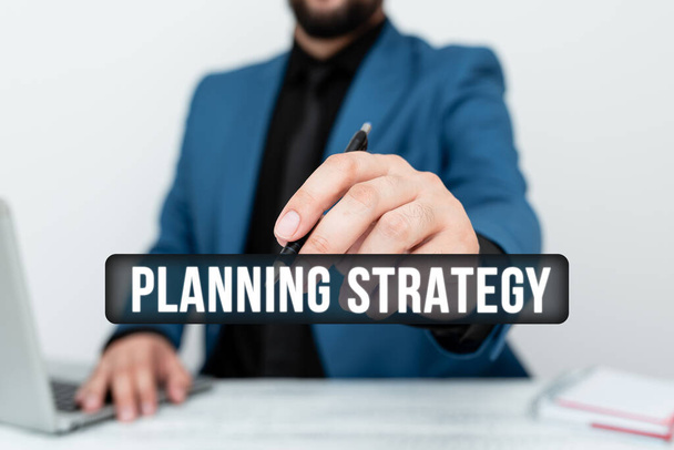 Sign displaying Planning Strategy. Business concept systematic process of envisioning a desired future Remote Office Work Online Presenting Business Plans Designs - Foto, imagen