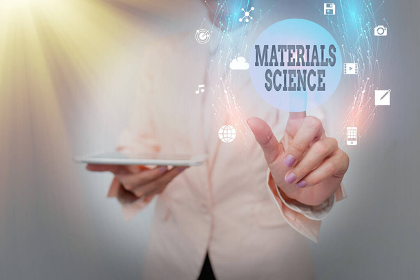 Writing displaying text Materials Science. Business concept interdisciplinary field involving the properties of matter Business Woman Using Phone While Presenting New Futuristic Virtual Display. - Photo, Image