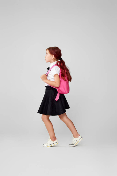 adorable schoolgirl with backpack. Back to school - 写真・画像