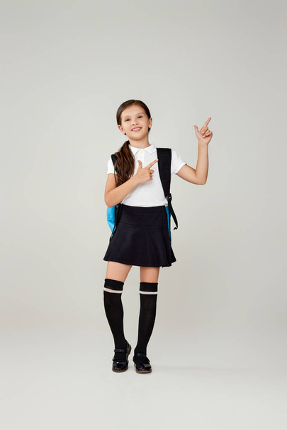 adorable schoolgirl with backpack. Back to school - Фото, изображение