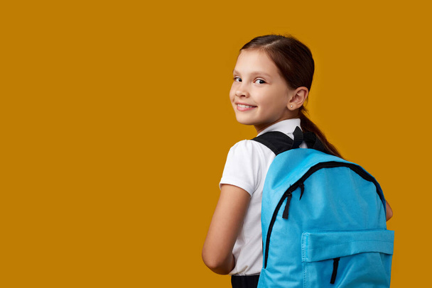 adorable schoolgirl with backpack. Back to school - Foto, afbeelding