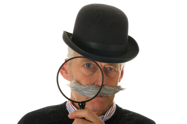Portrait of a funny inspector with a big magnifier for investigation - Foto, Bild