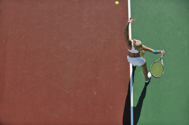 Young woman play tennis outdoor - Photo, Image