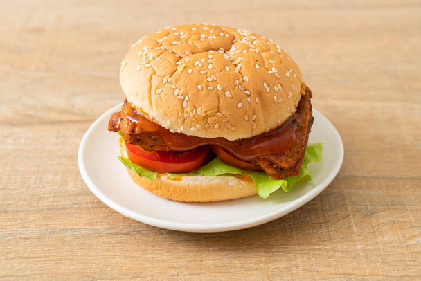 grilled chicken burger with sauce on white plate - Photo, Image