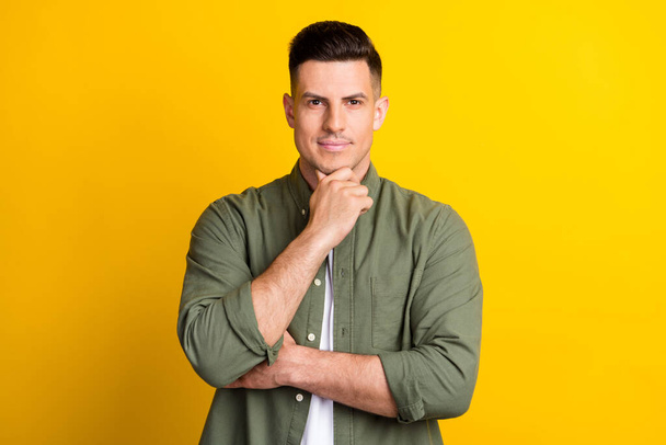 Portrait of attractive content cool guy touching chin making decision isolated over bright yellow color background - Φωτογραφία, εικόνα