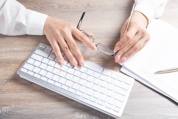 female hands typing on the keyboard. optical glasses - Fotografie, Obrázek