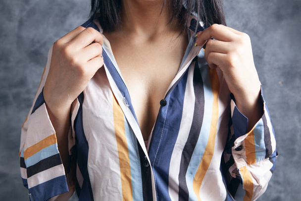 woman in a shirt and bras - 写真・画像
