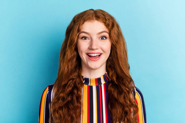Photo of impressed red hairdo young lady open mouth wear colorful shirt isolated on blue color background - Foto, imagen