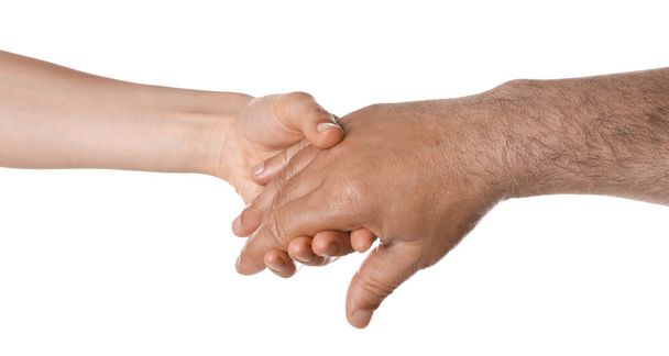 Woman holding hand of mature man on white background, closeup. Support concept - Φωτογραφία, εικόνα