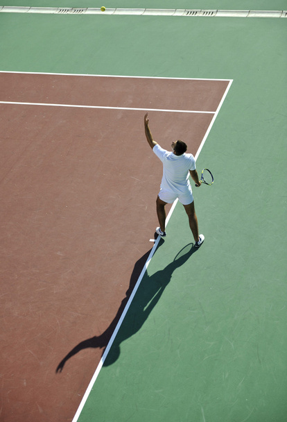 Young man play tennis - Fotó, kép