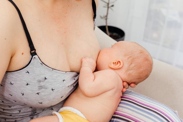 Mom and newborn baby resting after breastfeeding - Photo, Image
