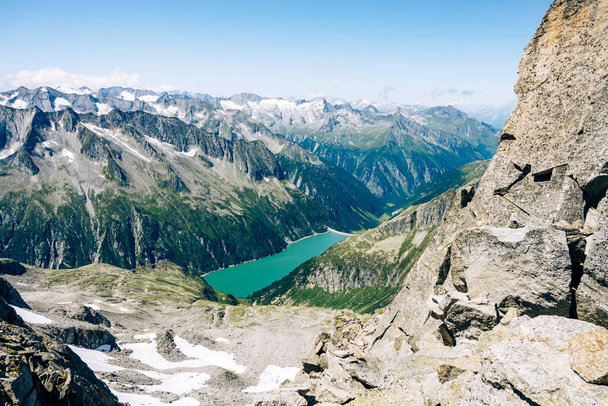 Summer alpine scenery with turquoise blue water reservoir - 写真・画像