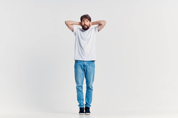 man in white t-shirt posing in studio. High quality photo - Photo, Image