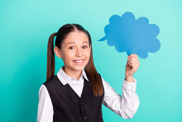 Photo portrait little girl smiling happy keeping cloud with blank space isolated pastel turquoise color background - 写真・画像