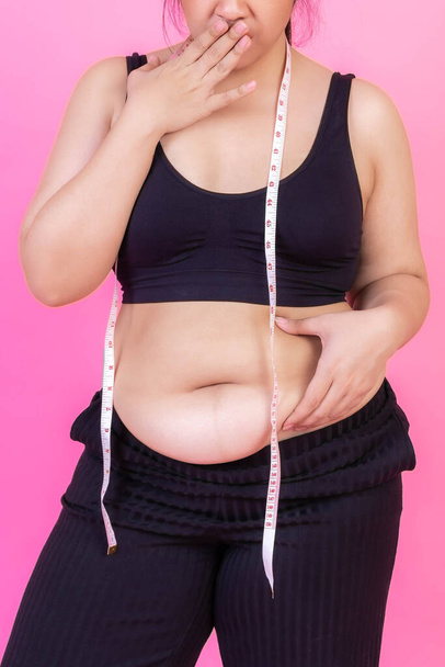 fat women , Fat girl , Chubby, overweight squeeze belly fat with measure tape on her neck - Woman diet lifestyle overweight problem concept - Foto, Bild