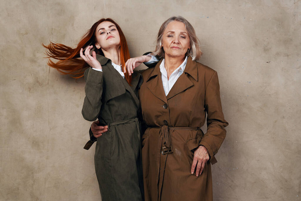 Mom and daughter in autumn coat fashion posing lifestyle - Photo, Image