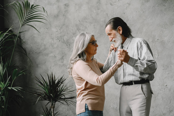 The happy elderly woman and a man dancing - Fotoğraf, Görsel