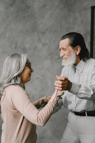 The happy elderly woman and a man dancing - Фото, зображення