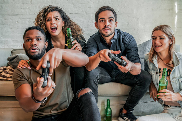 Group of friends playing video games together. - Фото, изображение