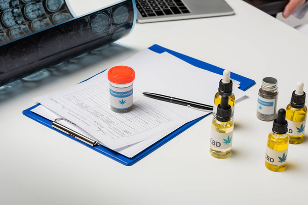 mri scan near prescription and medical cannabis medication on white desk - Foto, afbeelding