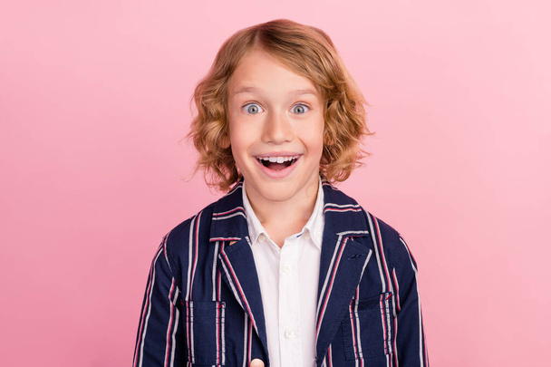 Photo of young handsome school boy kid excited happy positive smile information isolated over pink color background - Photo, Image