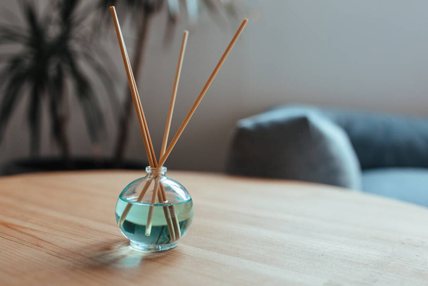 stylish air freshener stands on a wooden table close-up - Foto, immagini