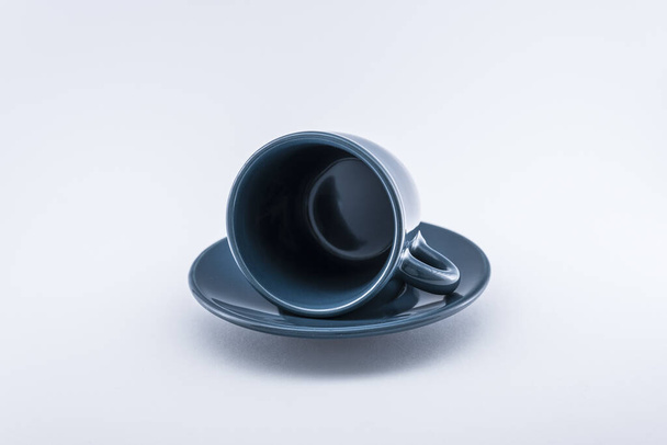 A horizontal shot of a espresso cup in three different position with white backgound. - Foto, afbeelding