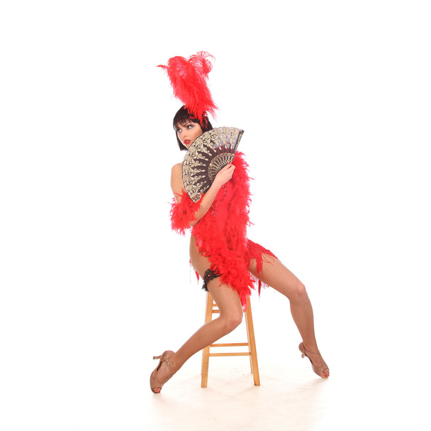 Burlesque dancer with red plumage and short dress, isolated on white - Фото, зображення