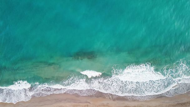 Aerial from drone of an stunning beautiful sea landscape beach with turquoise water at sunrise. Free copy space. - Valokuva, kuva