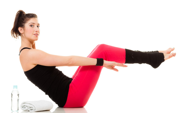 Flexible girl doing stretching pilates exercise - Valokuva, kuva