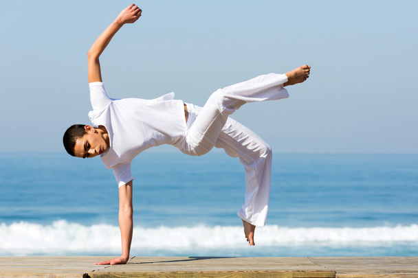 young woman practicing capoeira - Photo, image