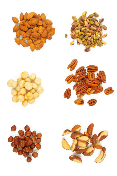 Nut assortment isolated on white background. Almonds, macadamia, pistachio, hazel, Brazilian, pecan nuts. - Φωτογραφία, εικόνα