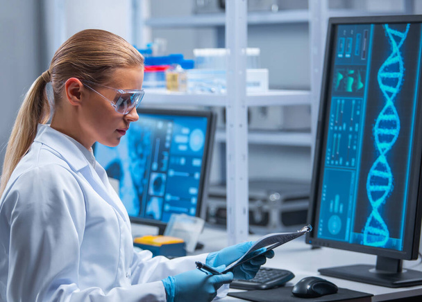 Female doctor works in a modern scientific laboratory using equipment and computer technologies. The scientist does research and develops new vaccines. Science and healthcare concept. - Foto, imagen