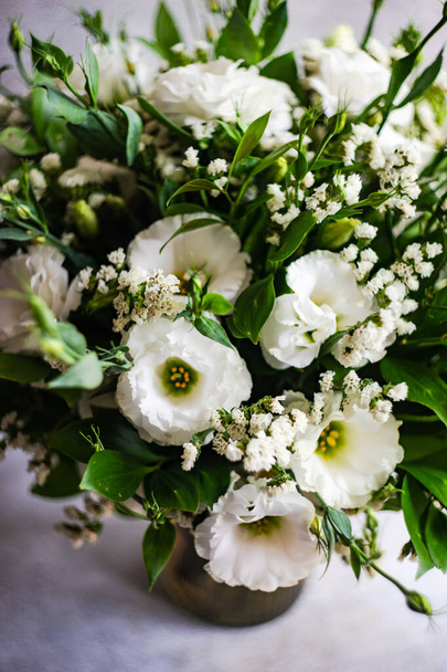 Beautiful white eustoma flowers in summer bouquet as a gift concept - Fotografie, Obrázek