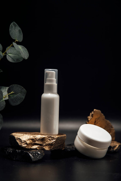 The composition of bottles of cosmetics for face care. A tube of gel, a jar of cream, empty packages without a brand. Advertising of skin care products - Photo, Image