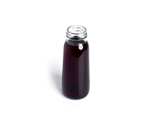 Cherry juice in bottle isolated on a white background.  - Photo, Image
