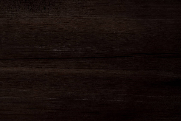 Madeira castanha escura e quebrada em padrão com uma superfície áspera para textura e fundo - Foto, Imagem