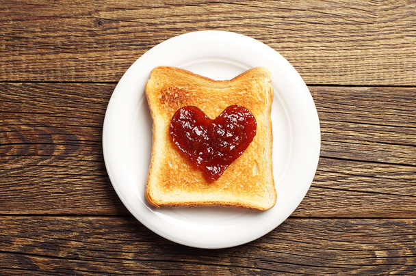 Toast with jam in shape of hearts - Фото, зображення