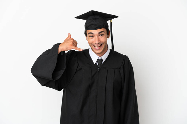 Young university graduate over isolated white background making phone gesture. Call me back sign - Фото, зображення
